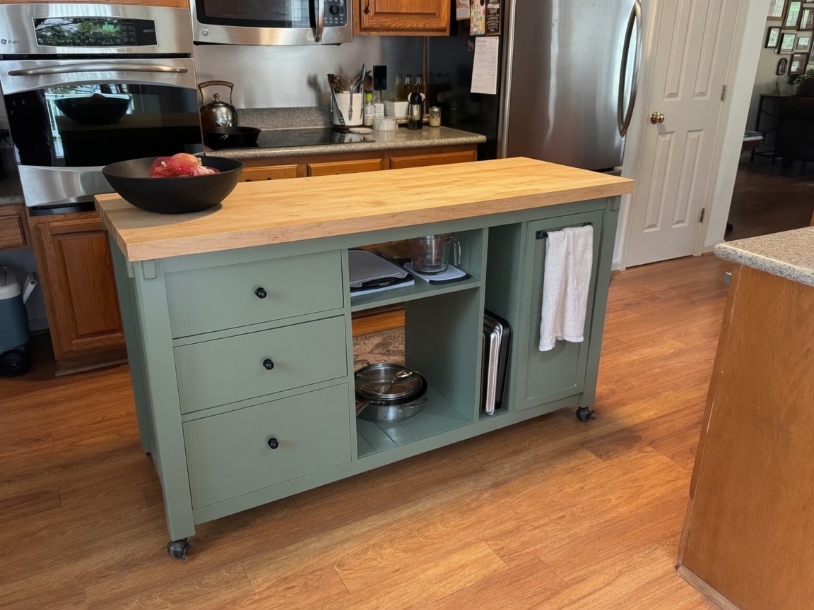 Custom kitchen island on antique bronze wheels with drawers on both sides